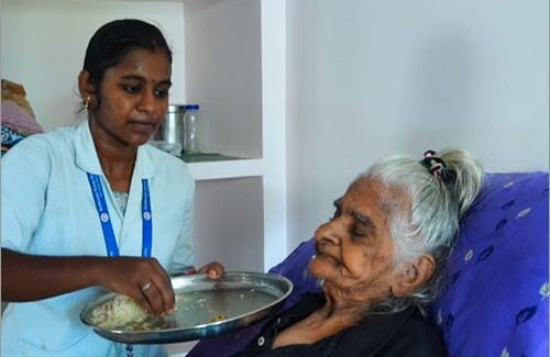 women feeding elderly
